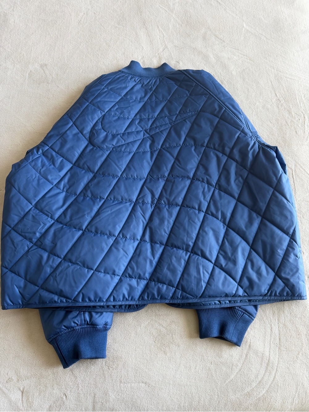 Nike women’s Quilted Puffer Jacket in Blue